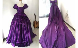 Bespoke purple off-shoulder ball gown with dramatic back bow and cathedral train - custom made by our studio